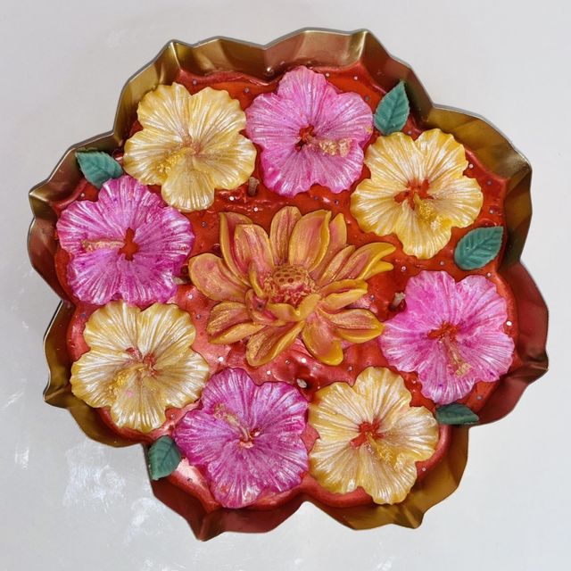 DH-06: Pink and yellow hibiscus around a lotus, in a scalloped metal tray, close-up of the hibiscus.