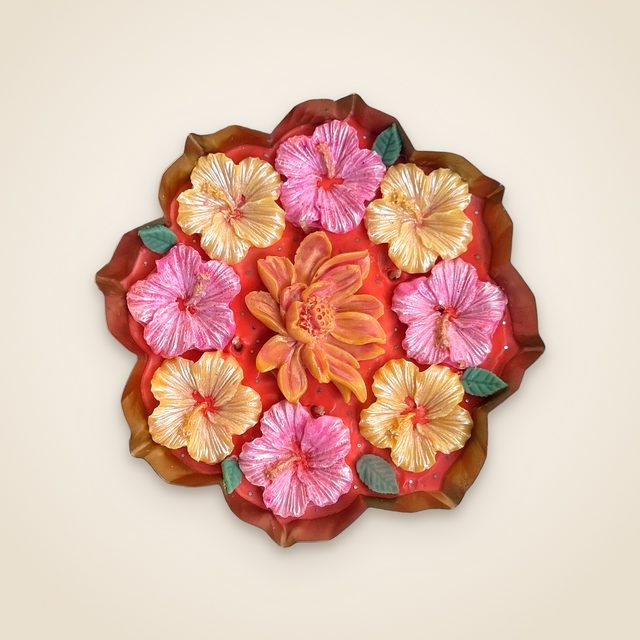 DH-06: Pink and yellow hibiscus around a lotus, in a scalloped metal tray.